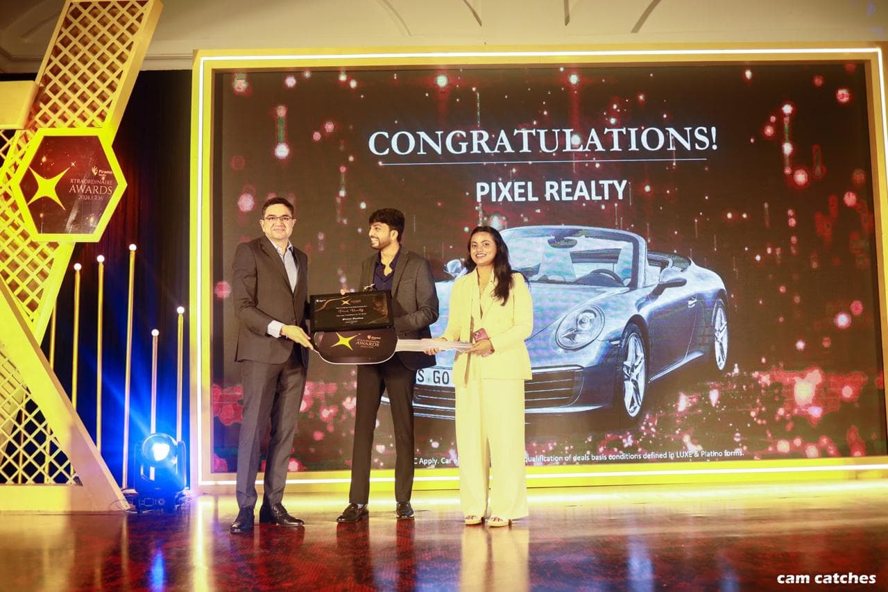 Properties By Ru receiving an award recognition on stage
